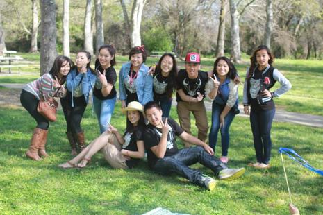 Group of students posing on grass